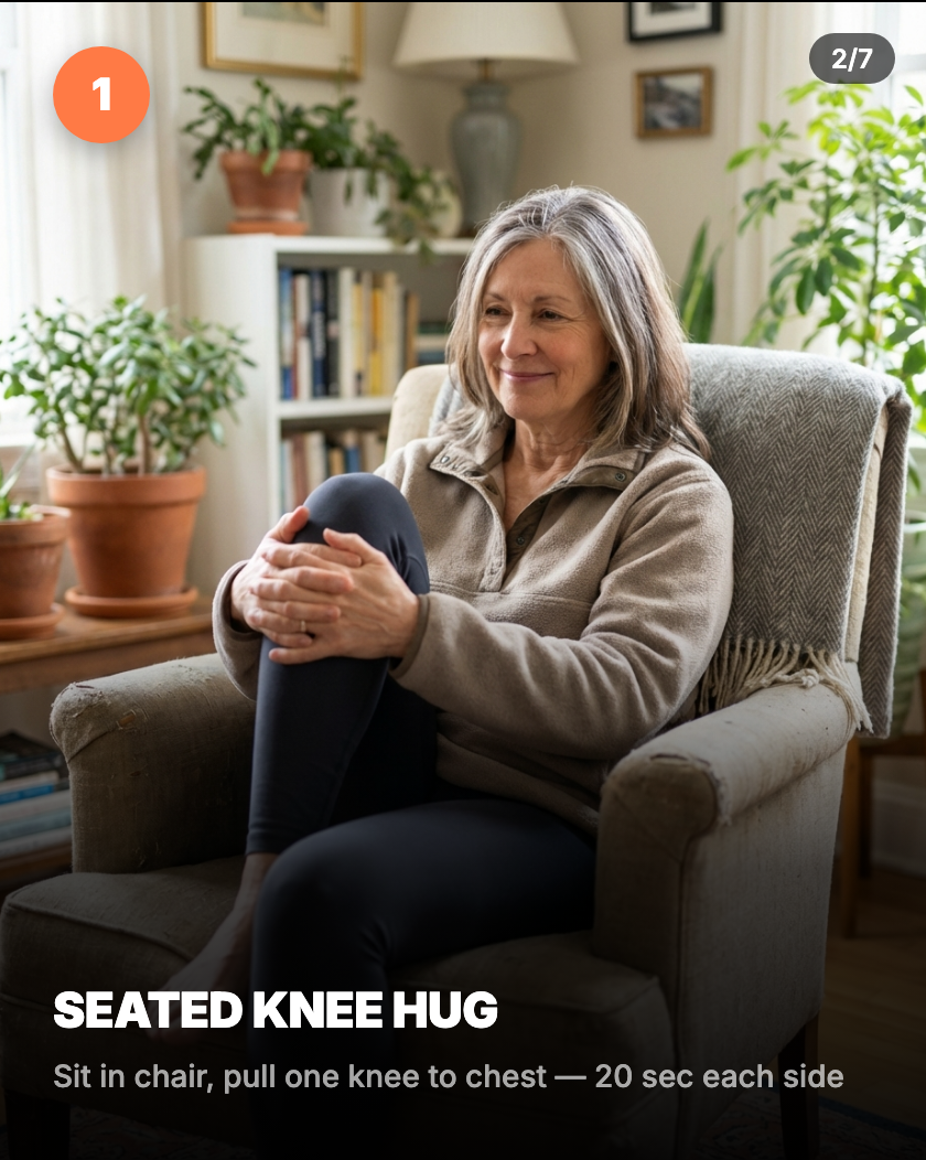Seated knee hug — sitting in chair, pulling one knee gently toward chest